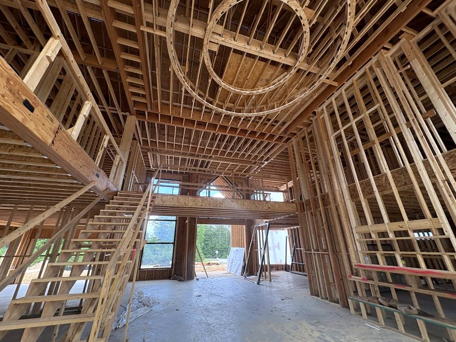 Framing for a two-story great room with circular ceiling details